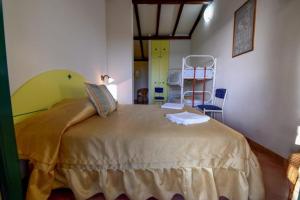 Postel nebo postele na pokoji v ubytování Hotel Club Torre Capovento