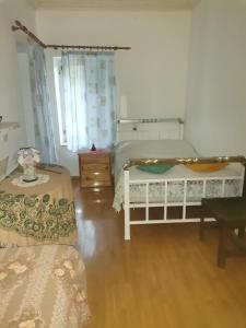 A bed or beds in a room at Ορεινή φιλόξενη κατοικια