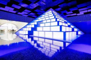 a room with a mirrored wall with blue lights at Radisson Collection Lingang Shanghai in Shanghai