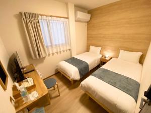 Katil atau katil-katil dalam bilik di AJITO Hostel & CafeBar