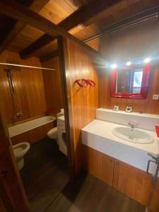 a bathroom with a sink and a toilet at Casa TOP para 14 personas en Garós, Ideal esquí in Garós +31 photos