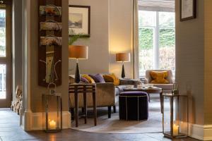 a living room with a couch and a table at Rothay Garden by Harbour Hotels in Grasmere