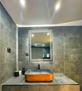 a bathroom with a sink and a mirror at Sevi House Suite in Thessaloniki