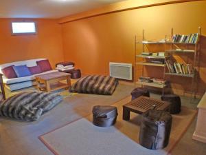 a living room with a couch and chairs and a table at Chalet Samoëns, 8 pièces, 14 personnes - FR-1-629-1 in Samoëns