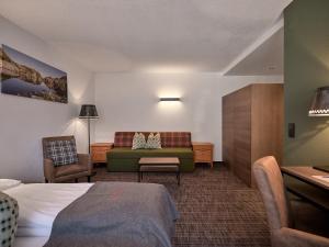 Łóżko lub łóżka w pokoju w obiekcie Panoramahotel Fliesserhof