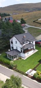 an aerial view of a large white house at Vila Dzavric in Zlatibor