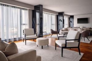 a living room with couches and chairs at Tunis Marriott Hotel in Tunis