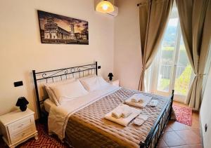 Postel nebo postele na pokoji v ubytování B&B Giardino delle Camelie
