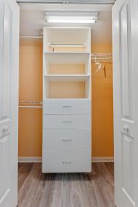a walk in closet with white closets at Spacious Nw Condo W Kitchen Balcony & Pool in North Wildwood
