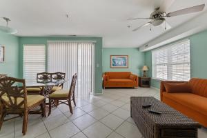 a living room with a couch and a table at Spacious Nw Condo W Kitchen Balcony & Pool in North Wildwood