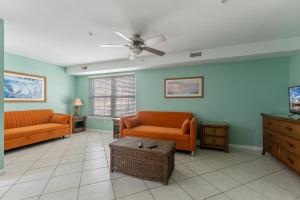 a living room with two couches and a ceiling fan at Spacious Nw Condo W Kitchen Balcony & Pool in North Wildwood