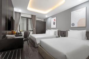 Postelja oz. postelje v sobi nastanitve Mercy Emerald Hotel