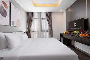 Postelja oz. postelje v sobi nastanitve Mercy Emerald Hotel