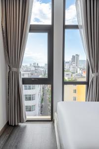 Postelja oz. postelje v sobi nastanitve Mercy Emerald Hotel
