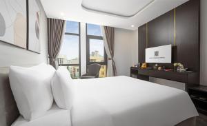 Postelja oz. postelje v sobi nastanitve Mercy Emerald Hotel