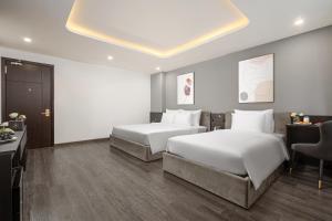 Postelja oz. postelje v sobi nastanitve Mercy Emerald Hotel