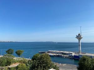 a lighthouse in the middle of a body of water at Mangana Konak Hotel in Istanbul