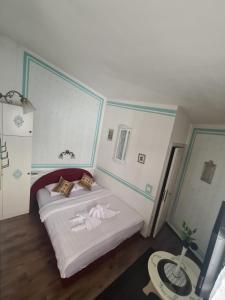 Postel nebo postele na pokoji v ubytování Guesthouse Yildiz