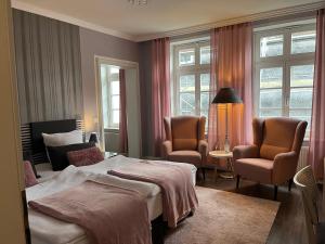 Postel nebo postele na pokoji v ubytování Rein Klassik Hotel