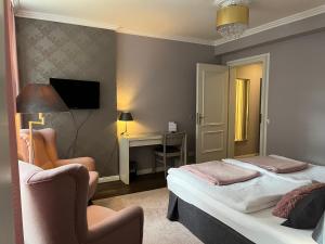 Postel nebo postele na pokoji v ubytování Rein Klassik Hotel