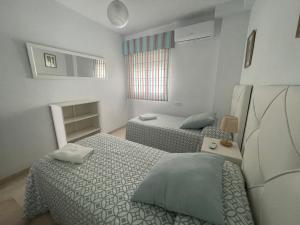Posteľ alebo postele v izbe v ubytovaní Alameda del Tajo III Centro Parquing
