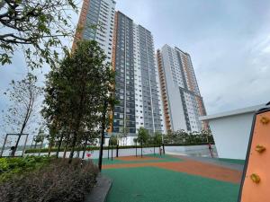 a playground in front of a building with tall buildings at Gembira Alanis by H Family #KLIA #Wifi #Netflix in Sepang