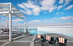 a deck of a cruise ship with chairs on it at São Paulo Nações Unidas Affiliated by Meliá in Sao Paulo