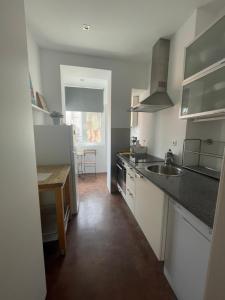 Kuchyň nebo kuchyňský kout v ubytování Penha Cozy Home