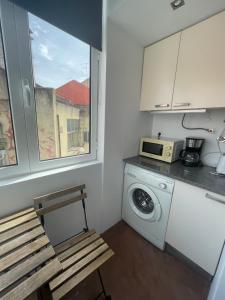 Kuchyň nebo kuchyňský kout v ubytování Penha Cozy Home + 6 fotografií