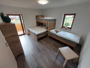 a room with two bunk beds and a table at Rezidence GreenHill ⃰ ⃰ ⃰ in Kraslice +42 photos
