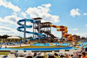 a large water park with a water slide at Pensiunea ober in Braşov