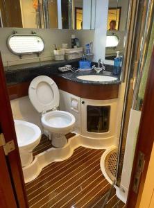 a bathroom with a toilet and a sink at Bodrum Yacht Rental in Yalikavak in Bodrum City