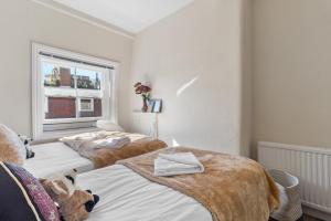 Letto o letti in una camera di Oxford Street London Apartments Hosted by Maysa