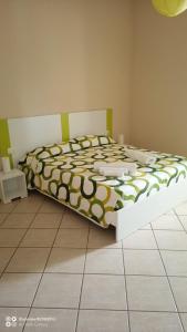 Кровать или кровати в номере CAMERE LA COMETA