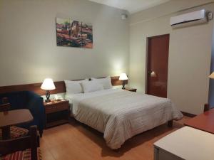 A bed or beds in a room at Lima Wasi Hotel Miraflores