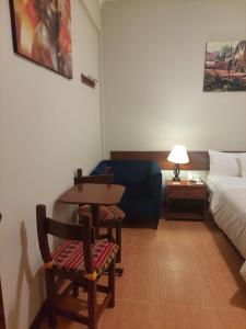 A bed or beds in a room at Lima Wasi Hotel Miraflores