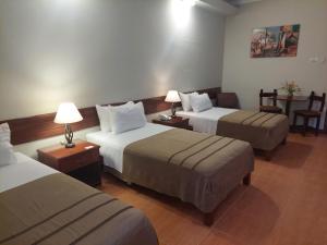 A bed or beds in a room at Lima Wasi Hotel Miraflores
