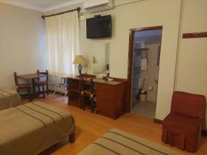 A television and/or entertainment centre at Lima Wasi Hotel Miraflores