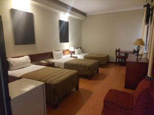 A bed or beds in a room at Lima Wasi Hotel Miraflores