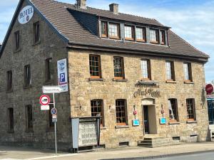 an old brick building on the corner of a street at Aal-Kate in Wuppertal