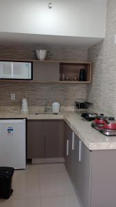 a kitchen with a sink and a counter top at Park Veredas in Rio Quente
