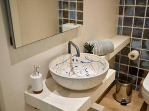 a bathroom with a bowl sink on a counter at APARTAMENTO VELA in Blanes