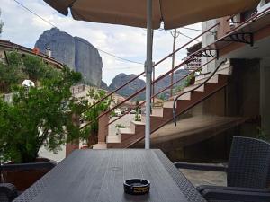 a picnic table with a view of the mountain at Kostis Hause in Kastrákion