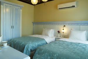 Postel nebo postele na pokoji v ubytování Bursa İpekyolu Hotel