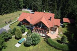 an overhead view of a house with an orange roof at Ferienparadies Truppe in Velden am Wörthersee