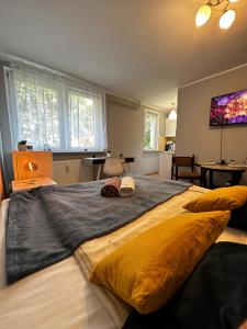 a bedroom with a large bed with two hats on it at Gdańsk Sea Apartment by YOCA in Gdańsk