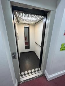 a hallway with a door leading to a walk way at YHA Whitby in Whitby