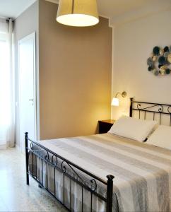 a bedroom with a bed and a lamp at Le Bassotte b&b in Perugia