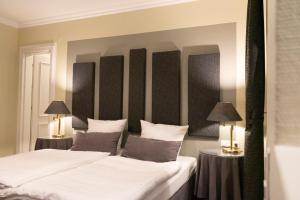 Postel nebo postele na pokoji v ubytování Rein Klassik Hotel