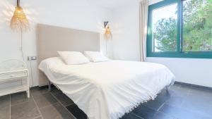 Postel nebo postele na pokoji v ubytování Cala Nostra - Puig + 21 fotografií